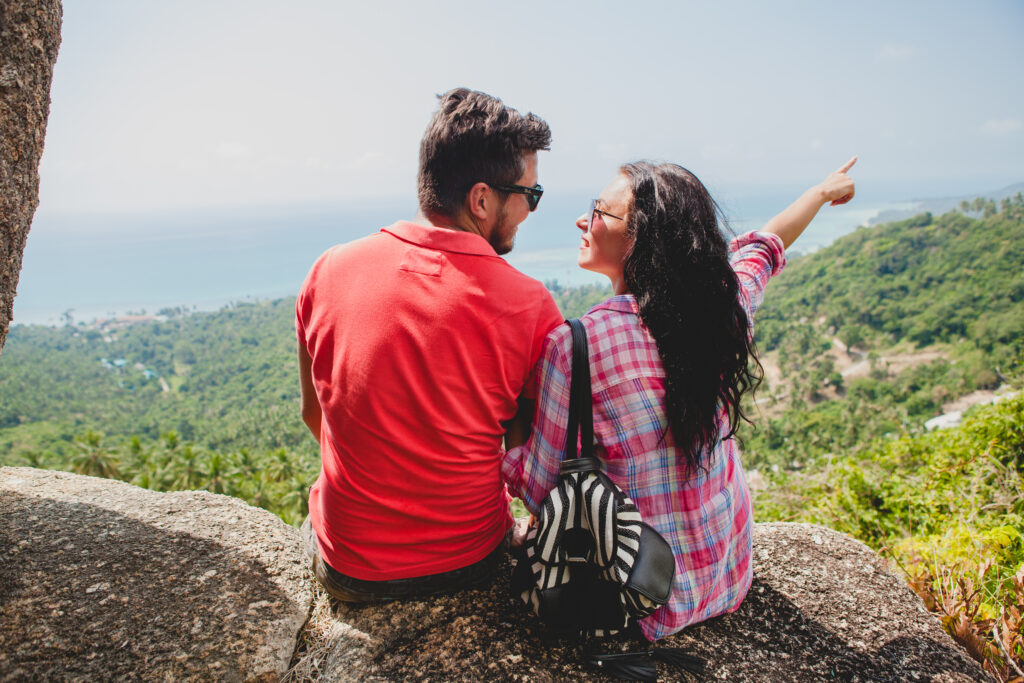 Romantic couple enjoying a scenic viewpoint in Munnar